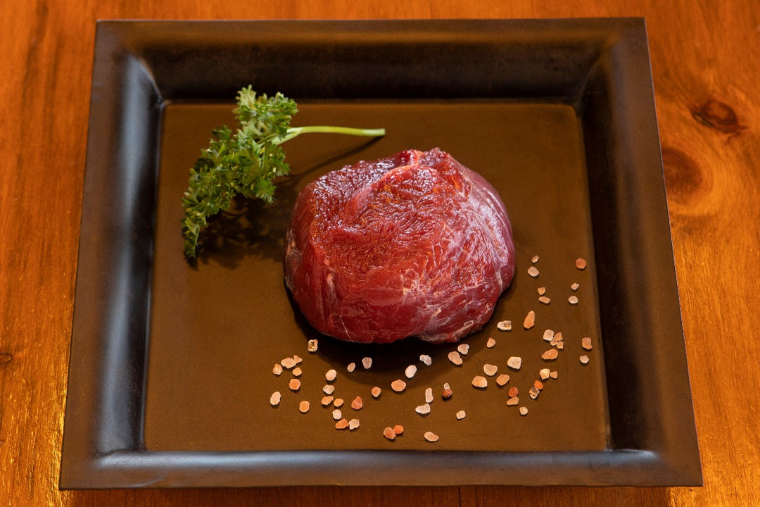 raw ostrich fan filet on plate