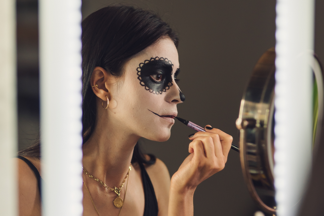 woman doing her halloween makeup 