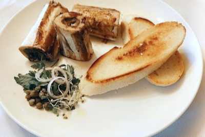 Roasted ostrich marrow bones with toast and herb salad