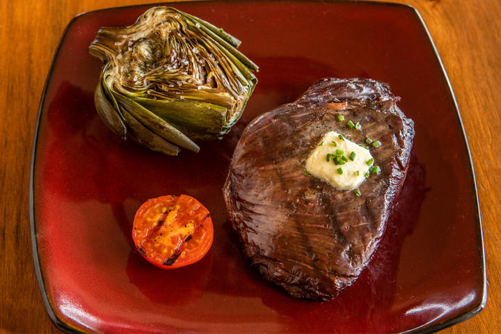 ostrich inside strip steak with grilled artichoke