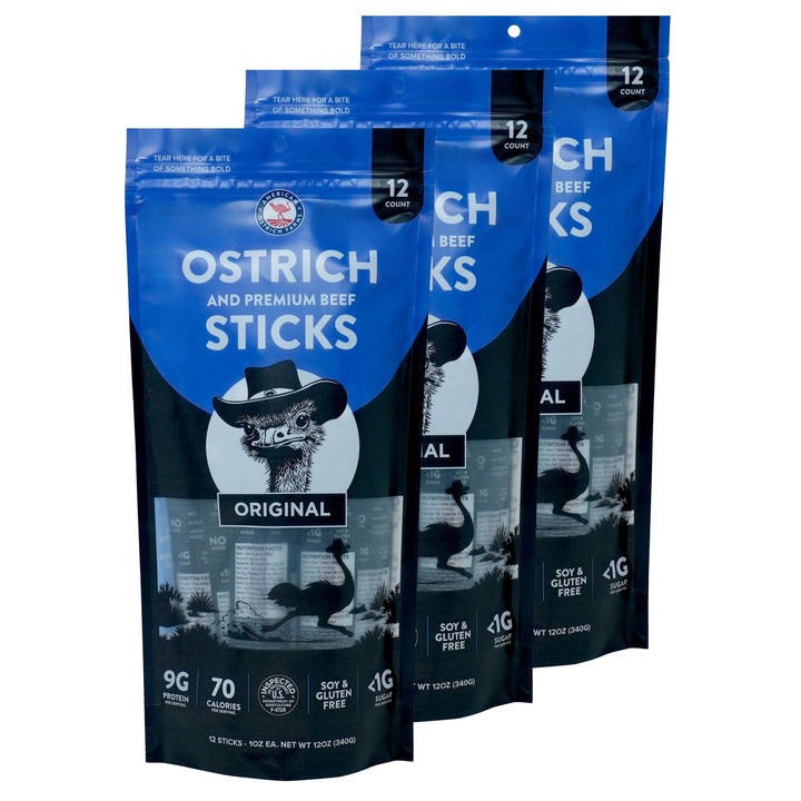 Three 12-pack bags of Original Flavor Ostrich and Premium Beef Sticks, featuring blue and black resealable pouches with a cartoon ostrich wearing a cowboy hat.