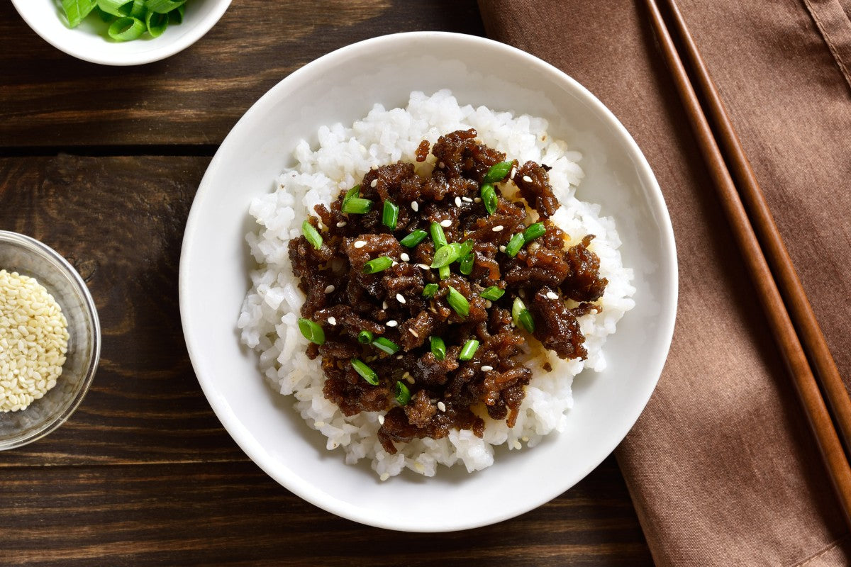 asian-style ground ostrich over steamed rice