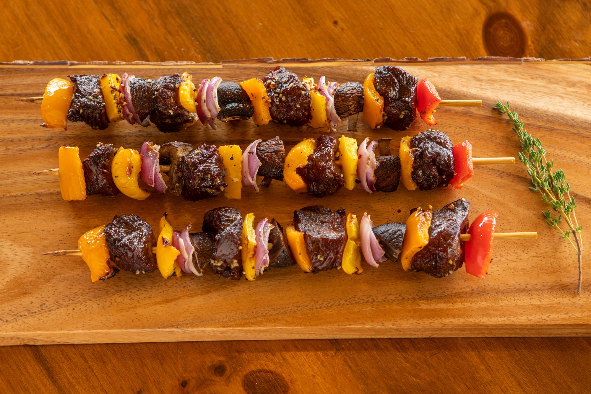 cooked shish kabobs with ostrich round peppers and onions