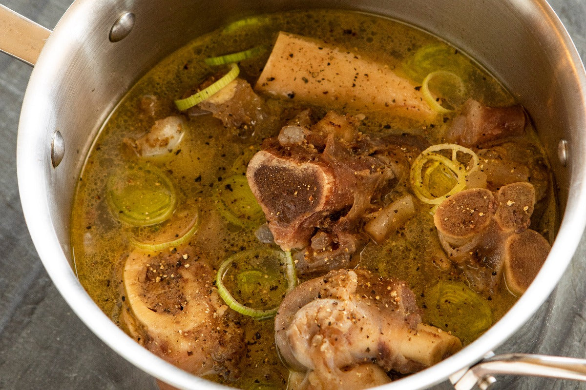 ostrich collagen bones in large pot of broth