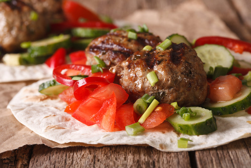 Ground lamb meatballs with mediterranean vegetable salad